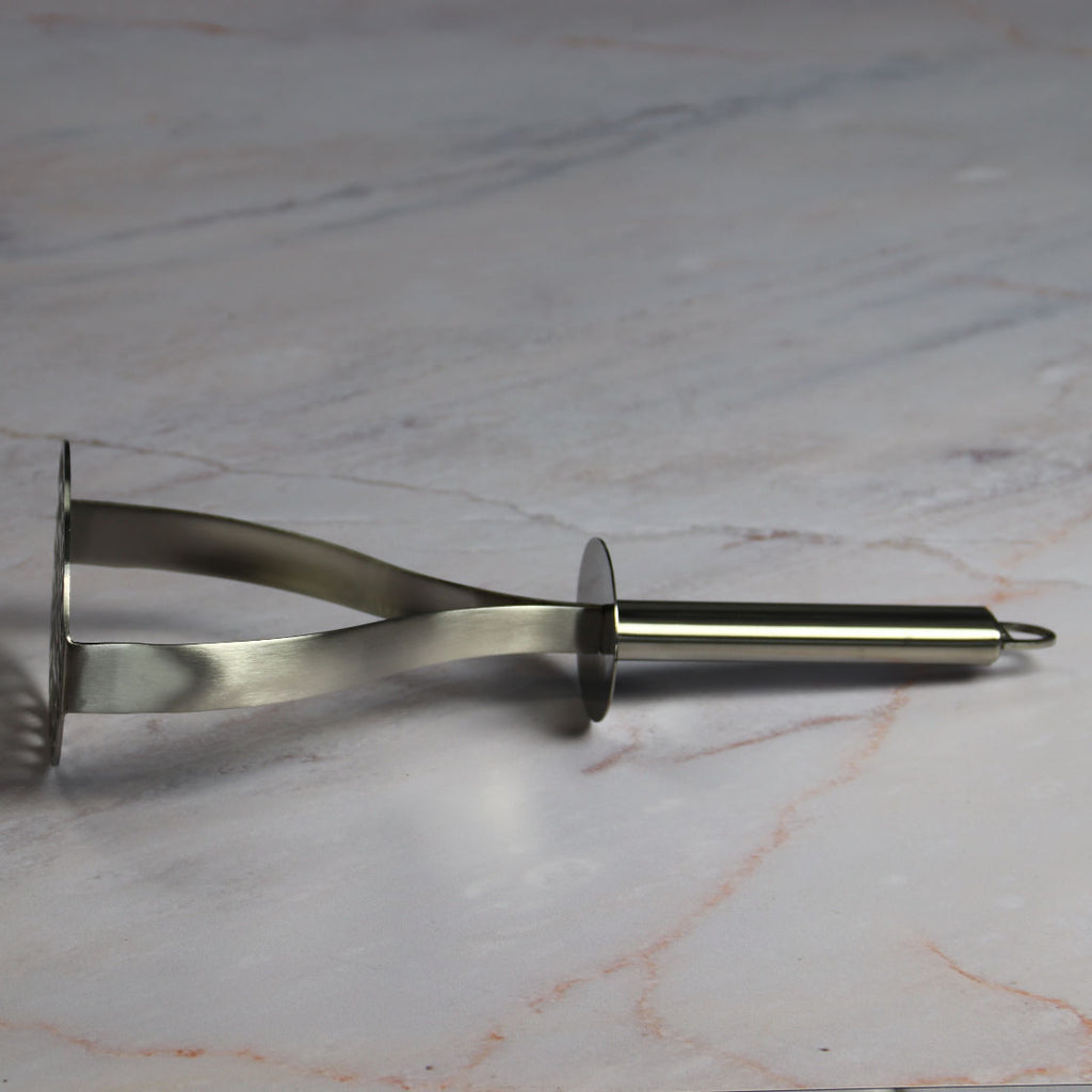 Cristel Potato Masher on Marble
