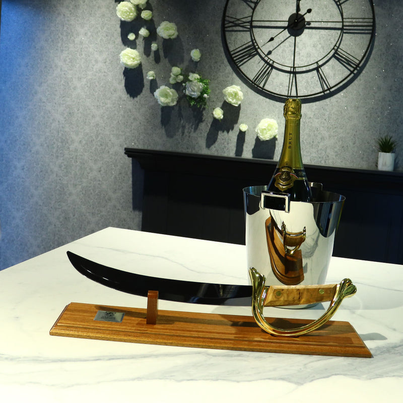 Napoleon champagne opener with olive wood handle on display stand - Claude Dozorme
