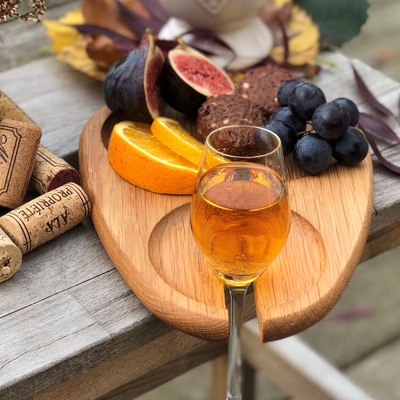 Cocktail Plate Glass Holder with Fruit and Glass of Wine on a Table